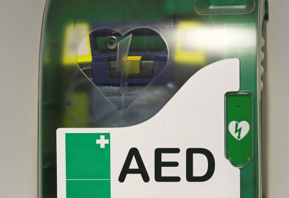 Automated external defibrillator emergency device at wall